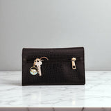 Woman’s Genuine Leather Button Tab Purse
