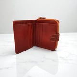 Woman’s Genuine Leather Button Tab Zip Around Wallet - Tan