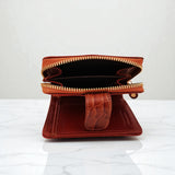 Woman’s Genuine Leather Button Tab Zip Around Wallet - Tan