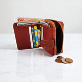 Woman’s Genuine Leather Button Tab Zip Around Wallet - Tan