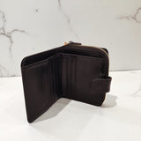 Woman’s Genuine Leather Button Tab Zip Around Wallet - Black