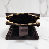 Woman’s Genuine Leather Button Tab Zip Around Wallet - Black