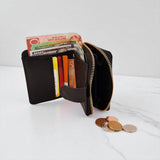 Woman’s Genuine Leather Button Tab Zip Around Wallet - Black